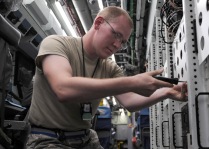 Senior Airman Ross Lemp, a 763rd Expeditionary Reconnaissance Squadron electronic warfare maintainer, performs routine maintenance onboard a RC-135V/W Rivet Joint May 6, 2013, at the 379th Air Expeditionary Wing. The RC-135’s are primarily used as an intelligence, surveillance and reconnaissance platform; picking up real-time information on oppositional forces. Toy and Lemp are deployed from Offutt Air Force Base, Neb. (U.S. Air Force photo/Staff Sgt. Joel Mease)